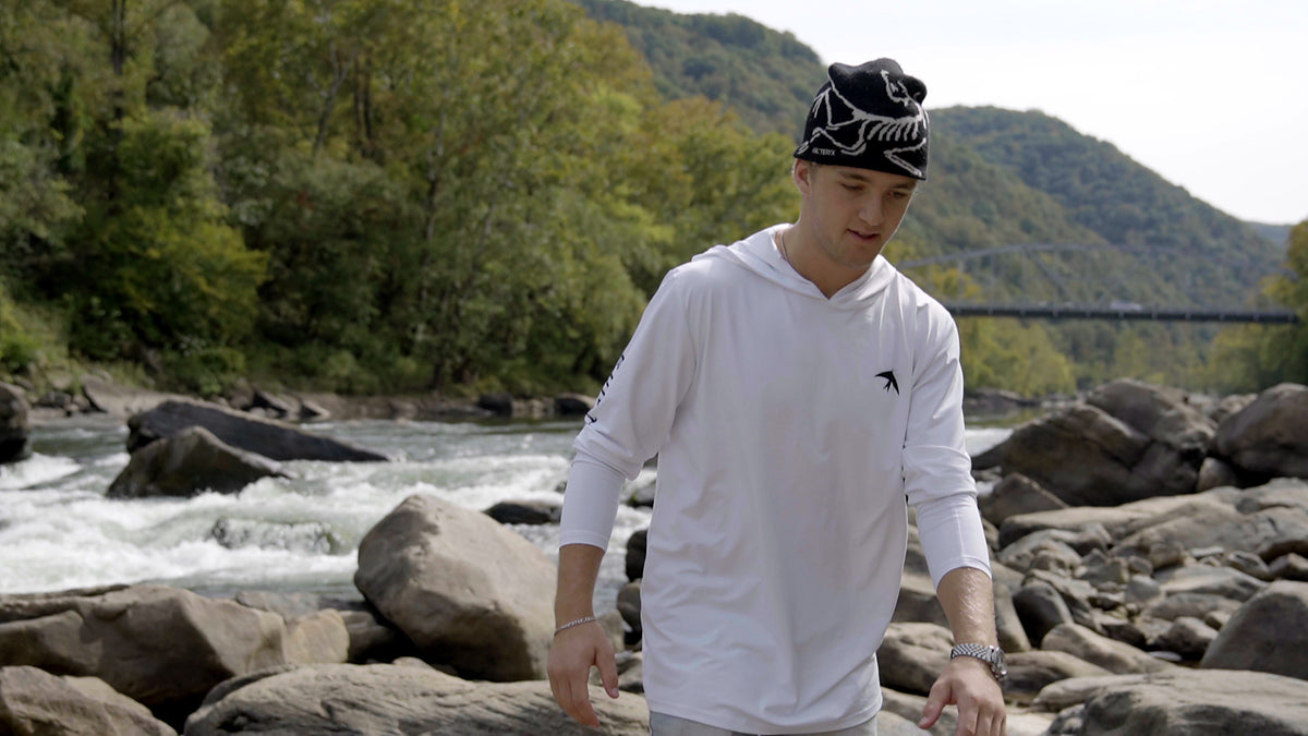 Front of the white Explorer UPF 50 sun hoodie with the BIRD chest logo