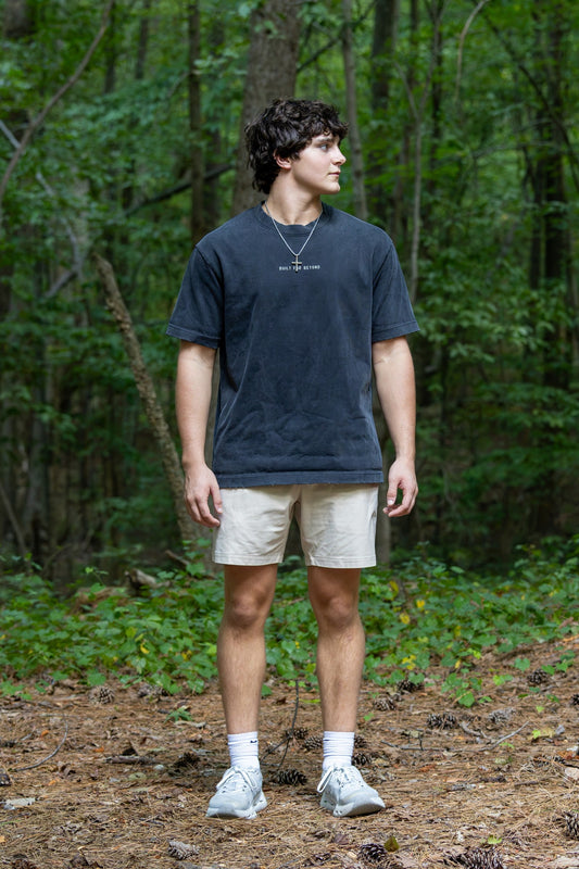 BIRD Go Further Tee, washed black, worn outdoors