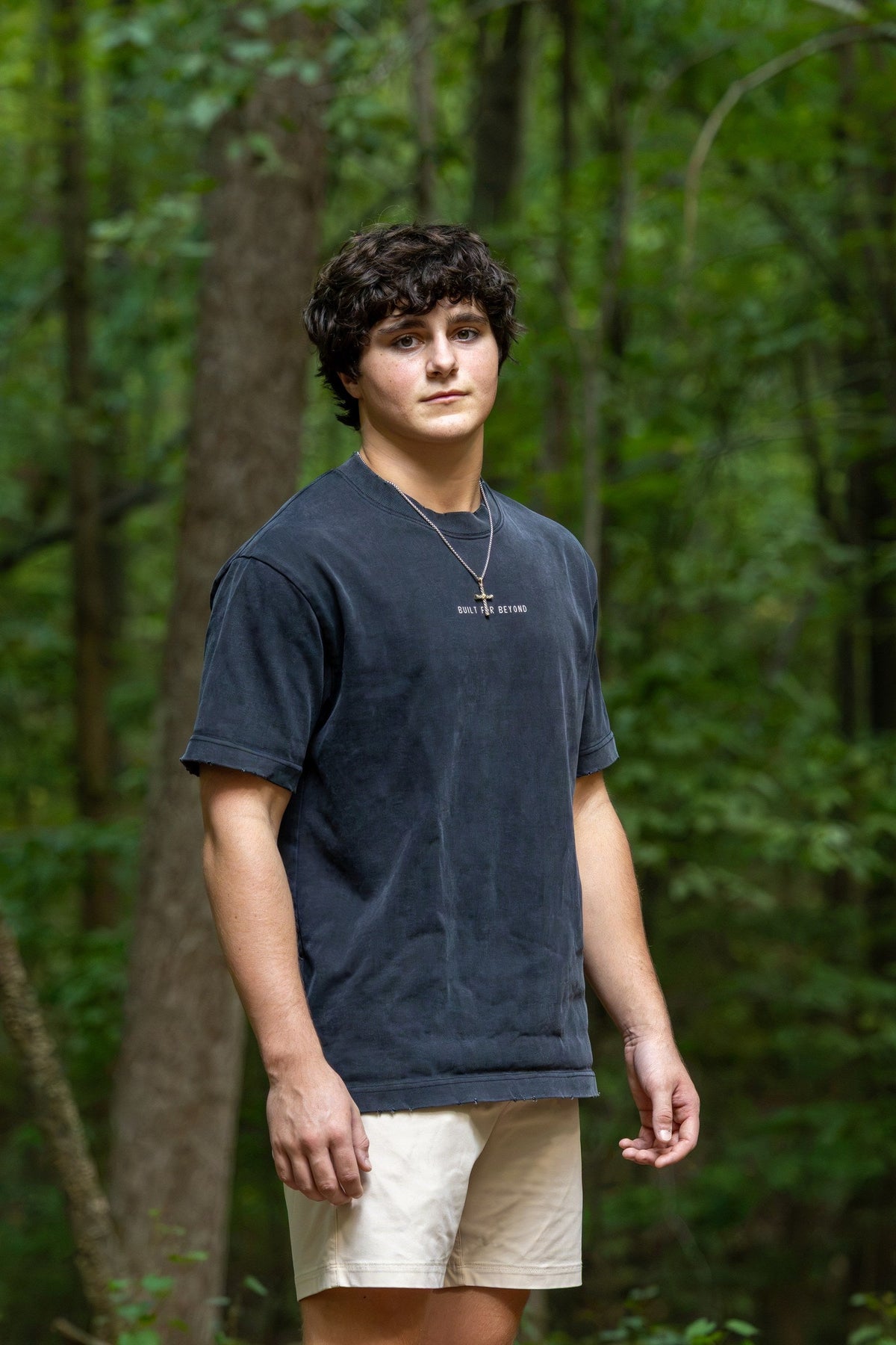 BIRD Go Further Tee, washed black, worn outdoors